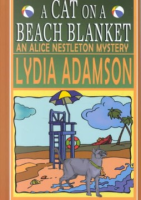 A_cat_on_a_beach_blanket